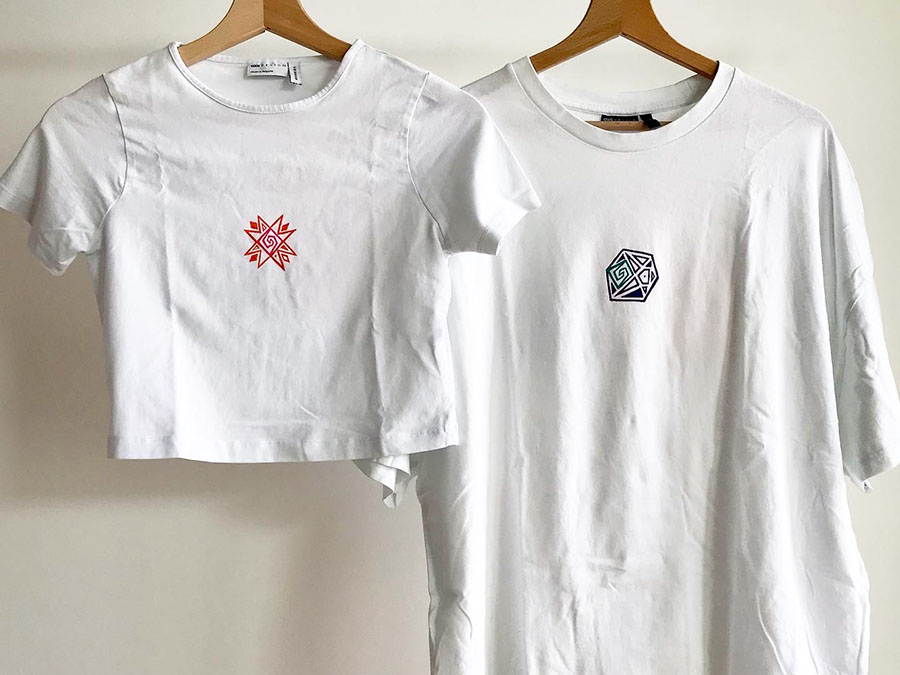 Tee-shirts (Tshirts) handpainted with a sun and moon motif.